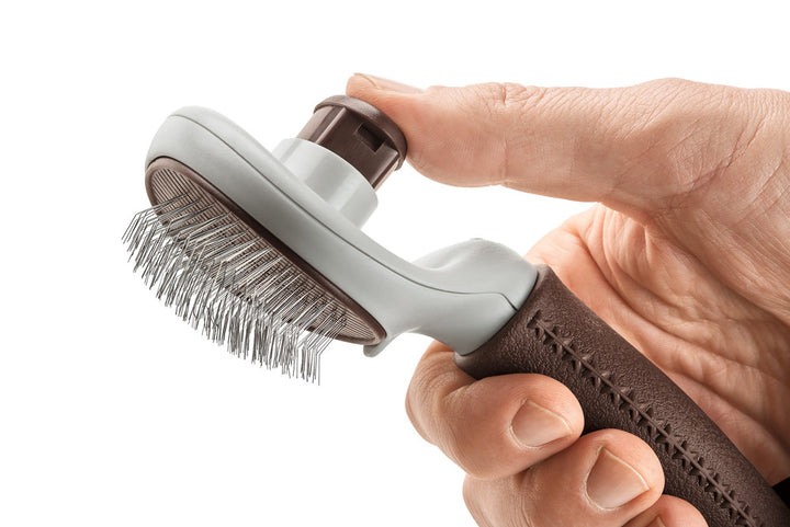 Self-Cleaning Slicker Brush SPA - Hunter Pet Store -grooming brush for long-haired, medium-length and short-haired dogs -extra soft stainless steel pins for gentle fur grooming -makes it easier to remove dead topcoat and undercoat fur -integrated button allows you to easily remove collected fur, self-cleaning -ergonomic handle with high-quality leather look