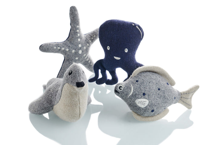 SKAGEN Seal - Hunter Pet Store -Cute dog toy in a maritime look, without squeaker -For small and medium-sized dogs -For playing, cuddling and loving -Made of up-cycled outer material and recycled filling -Attractive yet tough wool/polyester mix -Machine washable at 140 °F -9.8"